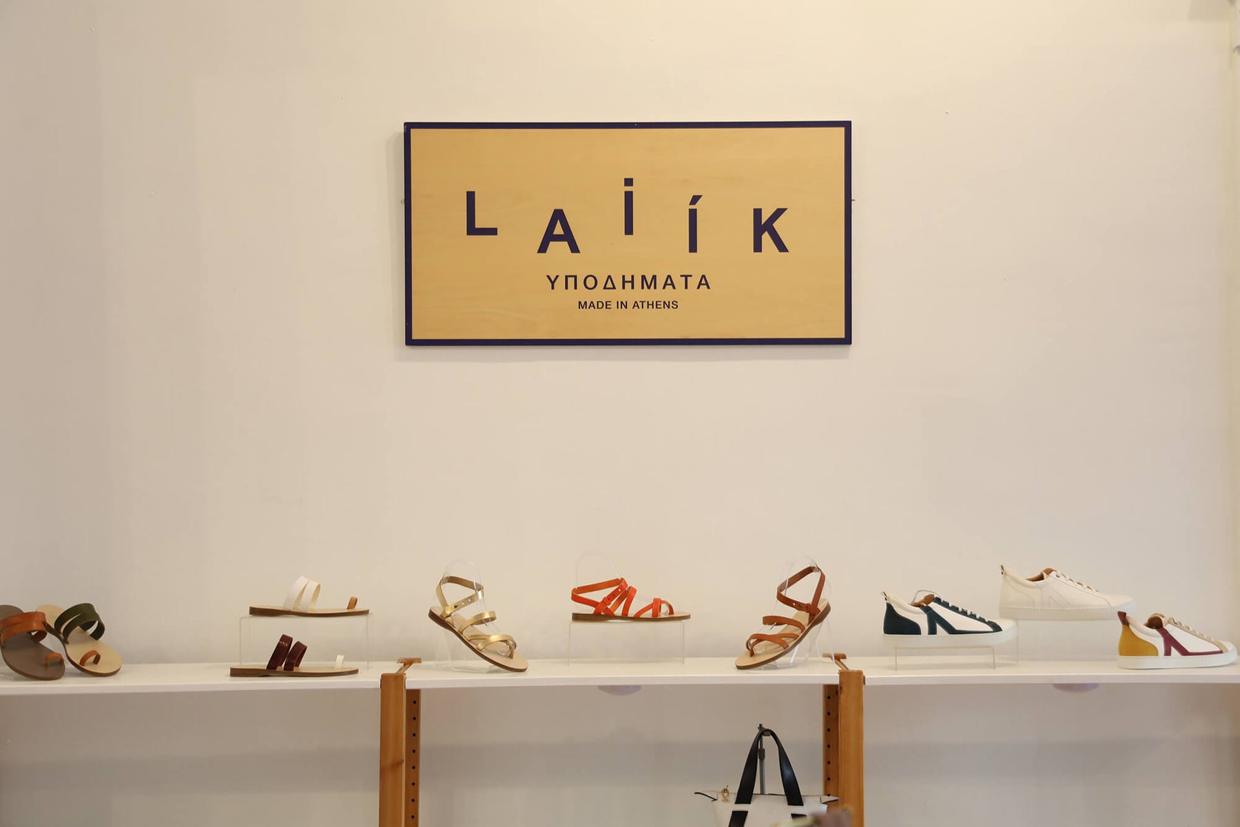 sign of laiik, sandals and shoes handmade in Greece at the store location in dupont circle, washington dc. shoe store in dupont circle
