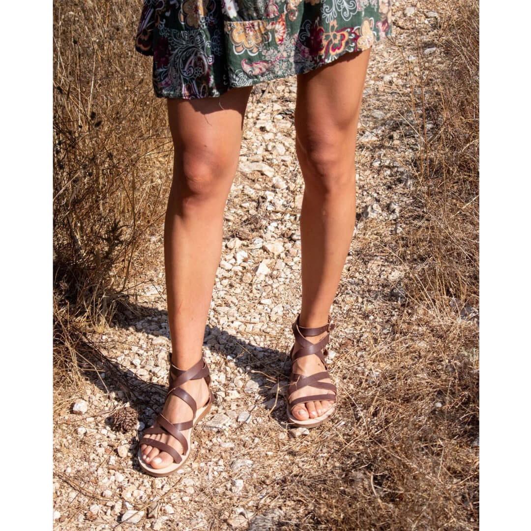 woman wearing greek gladiator sandals, italian leather, brown greek sandals #color_brown